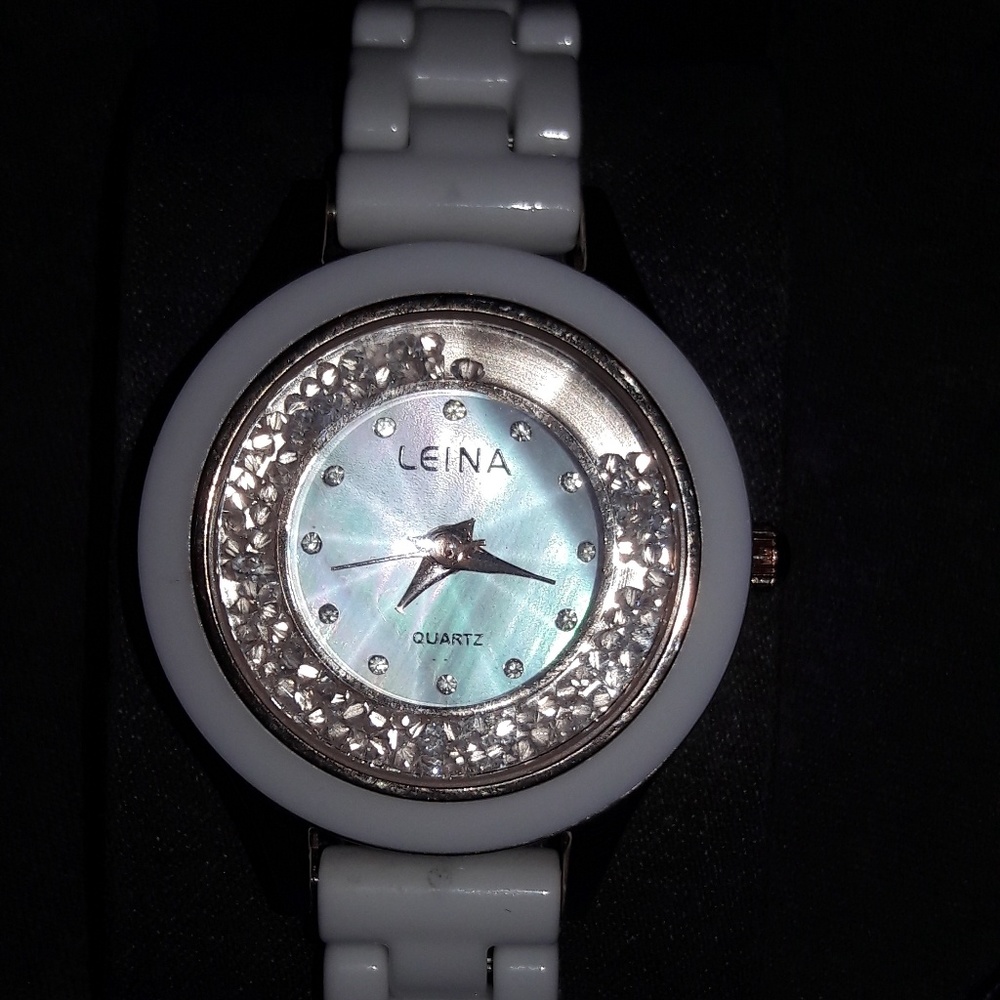 Women's white ceramic watch with gold flacks